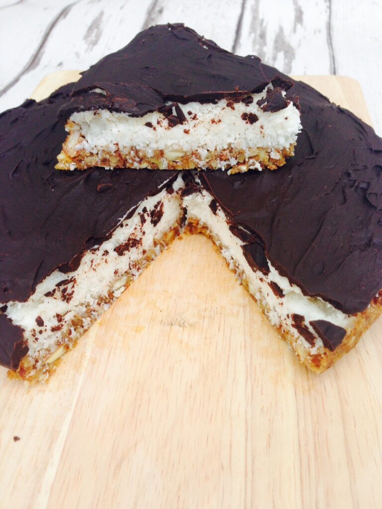 Bounty cake recipe which is healthy, gluten free, vegan, made with raw chocolate, coconut milk, some nuts and a bit of love? Yes, we are doing this! #veganrecipes #healthycake #coconutcake #bountycake #bounty #glutenfree #dairyfree 