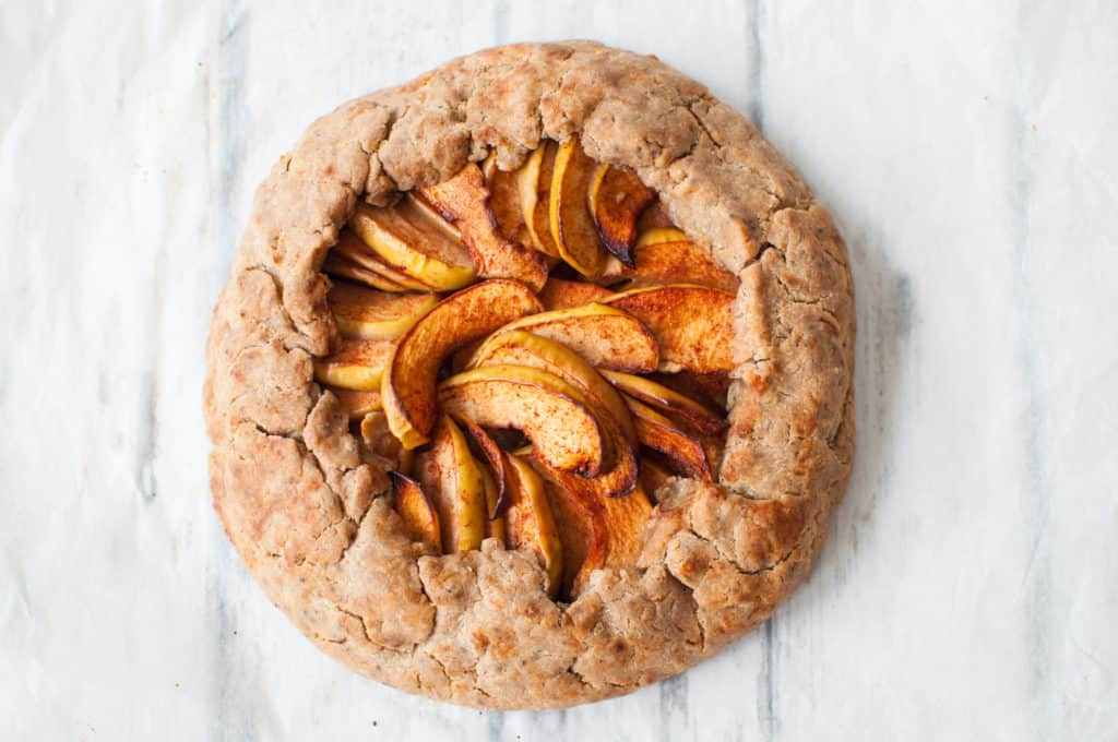 clean simple apple galette recipe which is a rustic tart requiring no baking skills, just apples, spelt flour and spices #cleaneating #vegan #nodairy