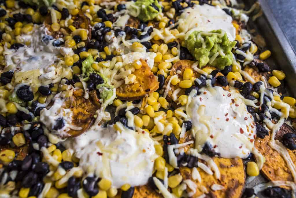 Satisfying, yet healthy sweet potato nachos recipe loaded with your favorite toppings to make the best nachos out of this world!
