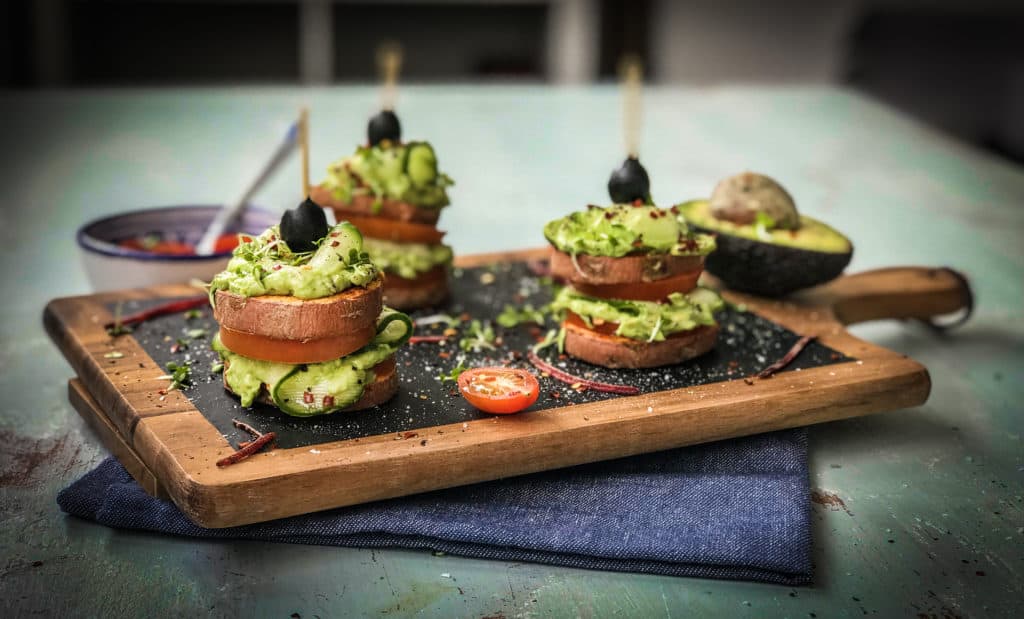 Healthy, loaded sweet potato stacks recipe with creamy avocado, beef tomatoes, ribbons of cucumber and loads of delicious spices. An easy, healthy side dish, appetizer, party food or a light meal! Paleo, Vegan and Whole30 compliant, family approved!