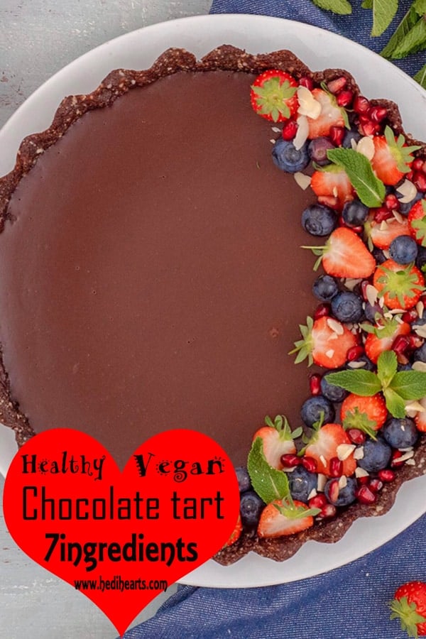 Really simple, healthy chocolate tart recipe to whip up for a last minute post-dinner treat or lazy Sunday cooking session. The rich, glossy chocolate ganache and gorgeous berries just bring it all together in the sweetest, freshest way! It's just pure, silky, smooth chocolate decadence #vegan #dairyfree #glutenfree #cleaneating