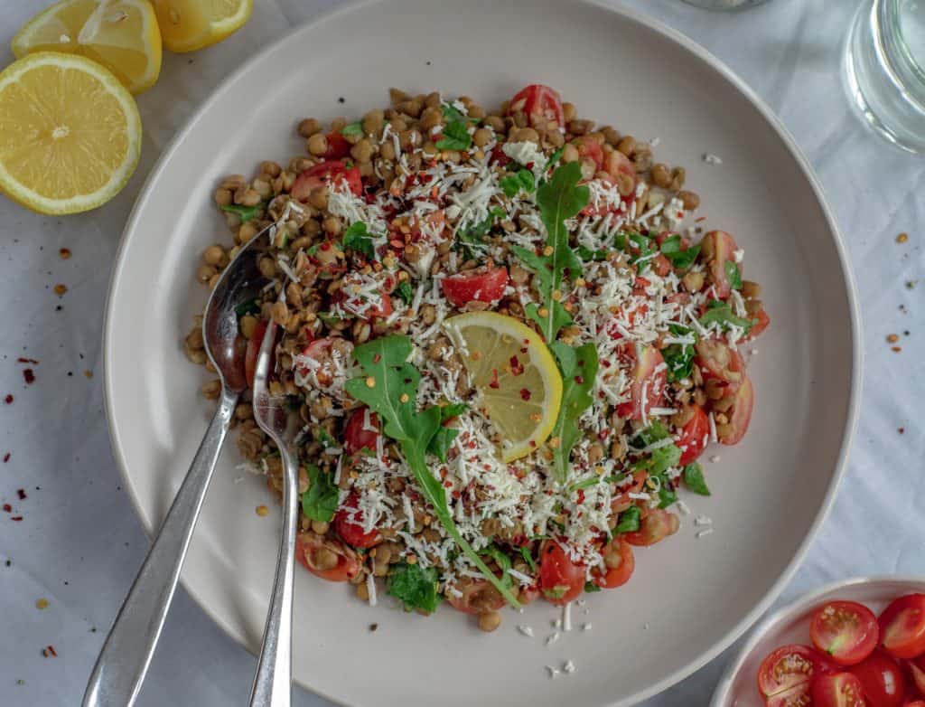 Healthy and easy lentil salad recipe with sweet cherry tomatoes, spinach, dairy free feta cheese all drizzled with a maple mustard dressing. Simply delicious!