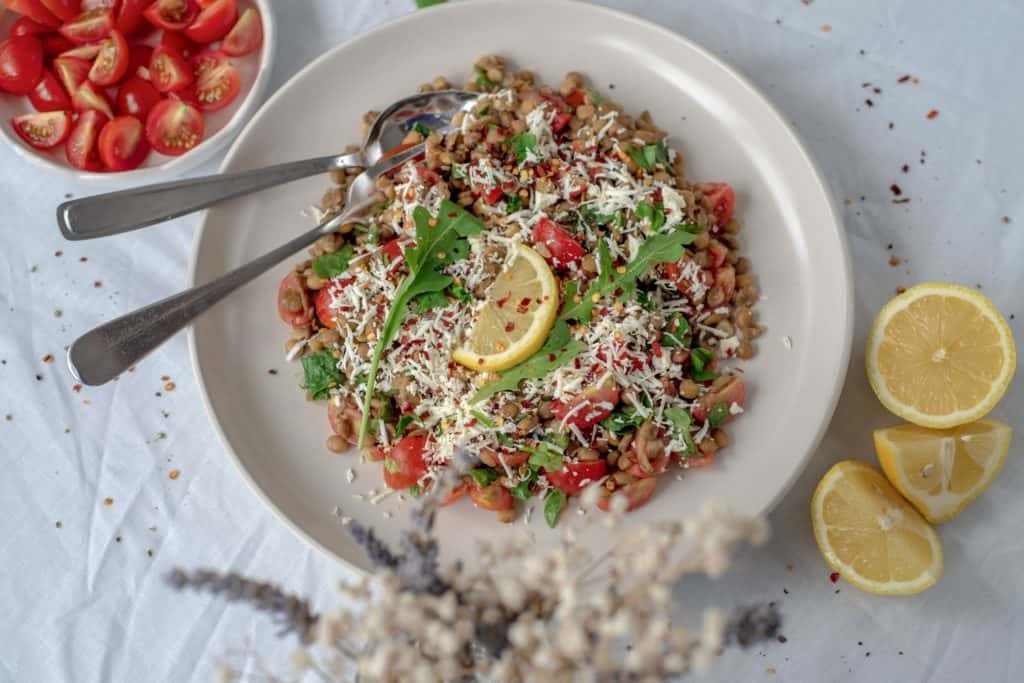 Healthy and easy lentil salad recipe with sweet cherry tomatoes, spinach, dairy free feta cheese all drizzled with a maple mustard dressing. Simply delicious!