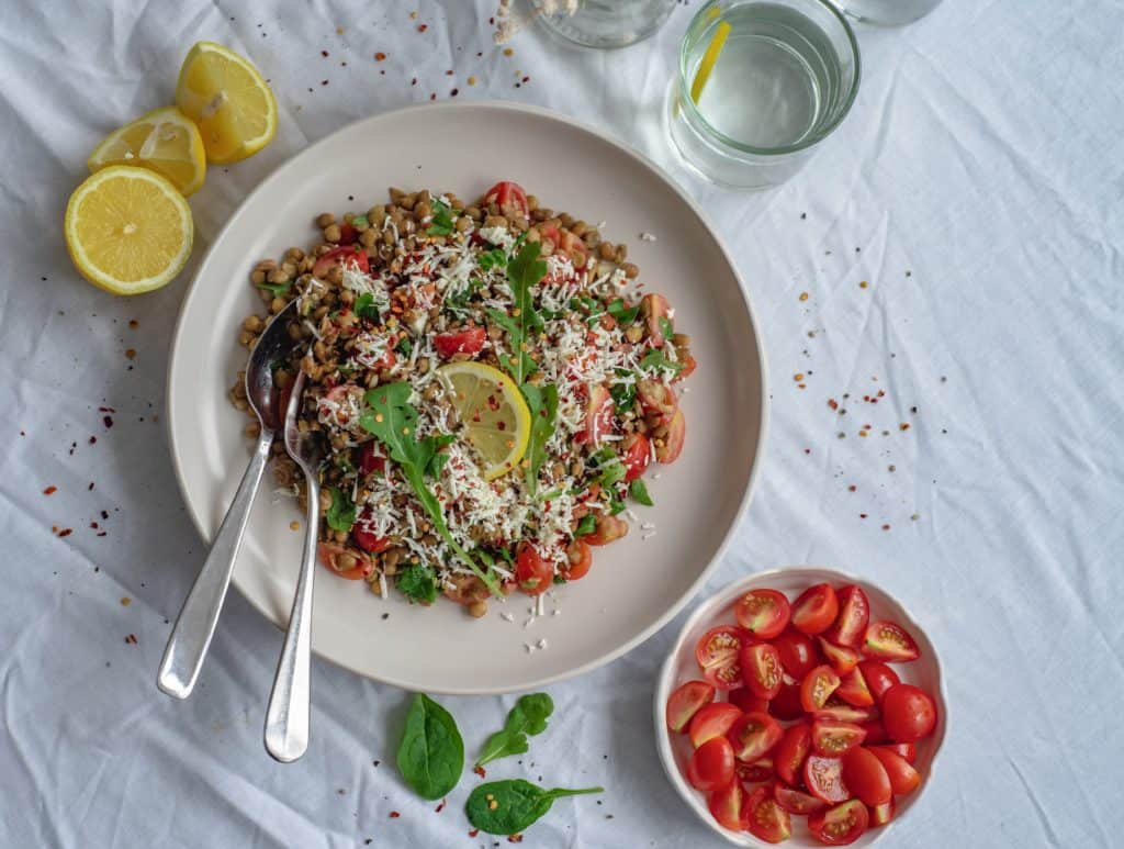 Healthy and easy lentil salad recipe with sweet cherry tomatoes, spinach, dairy free feta cheese all drizzled with a maple mustard dressing. Simply delicious!