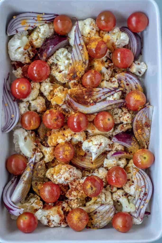 Absolutely delicious one-pot healthy cauliflower bake recipe served with lush tahini and yoghurt dressing. Super-satisfying while vegan, gluten & grain free!#veganrecipes #glutenfree #dairyfree #cauliflowerbake #healthyrecipes #cleanrecipes #cleaneating #easyrecipes 