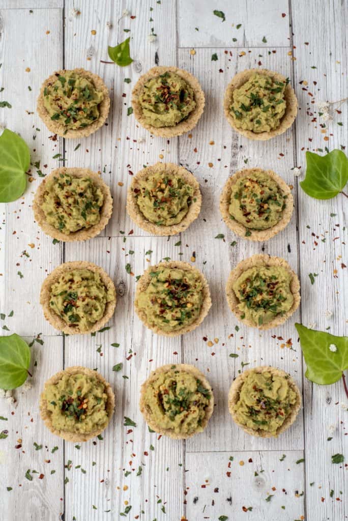 Savoury easy party tartlets recipe served with lush avocado hummus. The perfect dairy free and gluten free party starter or delicious snack for the family! #glutenfree #partysnacks #vegansnacks #avocadohummus #easyrecipes #healthyfood 