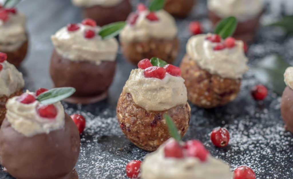 close up of balls with topping and pomegranates