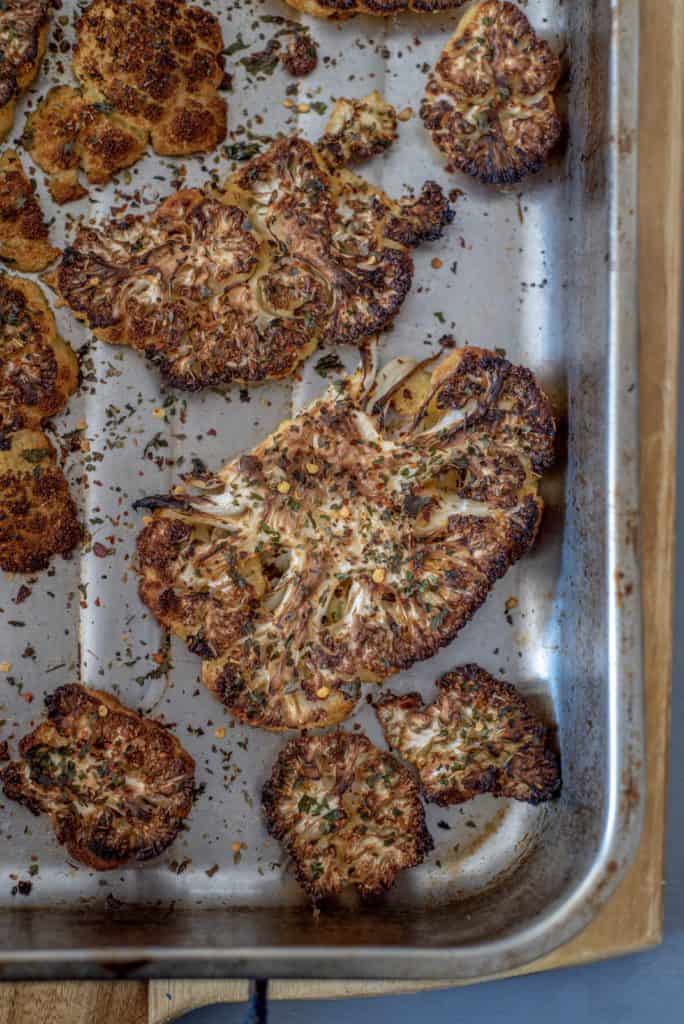 Cauliflower steak with smoky spinach lentils recipe is packed with protein, fiber, flavour, and makes a great weeknight dinner. It's vegan and gluten-free. #cleaneatingvegetarian #cleaneatingvegan #cauliflowerrecipes #meatfree #meatless #cleanrecipes #cleandinner #vegandinner #veganlunch #healthyrecipes #healthydinner 