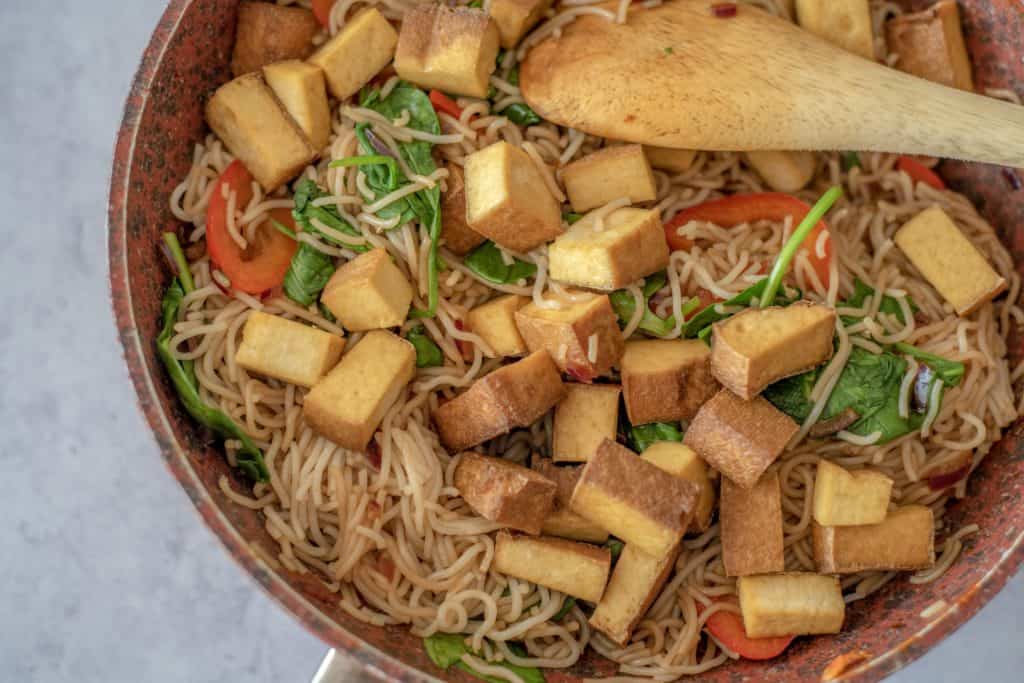 Healthy Rice Noodle Bowl with Crispy Tofu recipe which is fresh, quick, satisfying, lots of vegetables, and plenty of protein all ready in 30 minutes. Vegan and gluten free too! #healthyeatingrecipes #healthydinnerideas #vegandinners #healthyvegan #easyhealthyrecipes # cleaneatingrecipes #cleaneating #glutenfreedinner