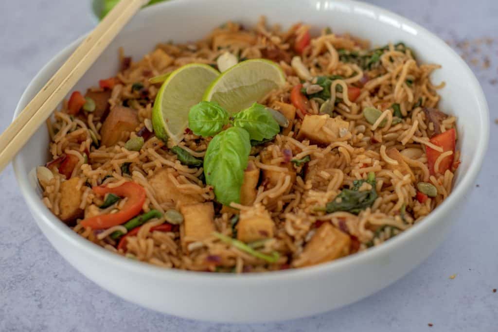 Rice Noodle Bowl with Crispy Tofu recipe which is fresh, quick, satisfying, lots of vegetables, and plenty of protein all ready in 30 minutes. Vegan and gluten free too! #healthyeatingrecipes #healthydinnerideas #vegandinners #healthyvegan #easyhealthyrecipes # cleaneatingrecipes #cleaneating #glutenfreedinner