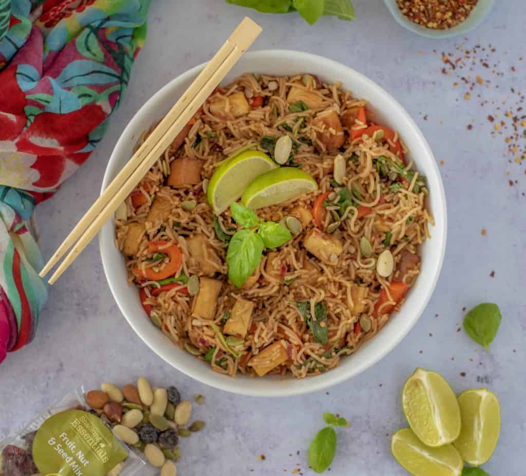 Rice Noodle Bowl with Crispy Tofu recipe which is fresh, quick, satisfying, lots of vegetables, and plenty of protein all ready in 30 minutes. Vegan and gluten free too! #healthyeatingrecipes #healthydinnerideas #vegandinners #healthyvegan #easyhealthyrecipes # cleaneatingrecipes #cleaneating #glutenfreedinner