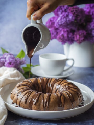 Melted chocolate and crushed nuts make this easy and healthy Bundt cake the perfect Sunday treat.