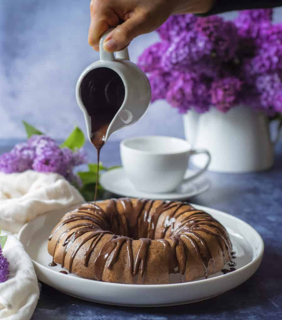 Melted chocolate and crushed nuts make this easy and healthy Bundt cake the perfect Sunday treat.