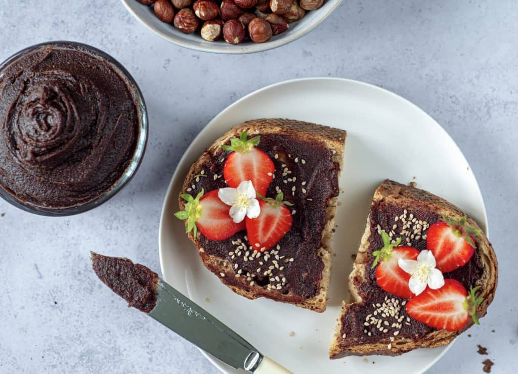 Healthy Nutella toast with fresh strawberries