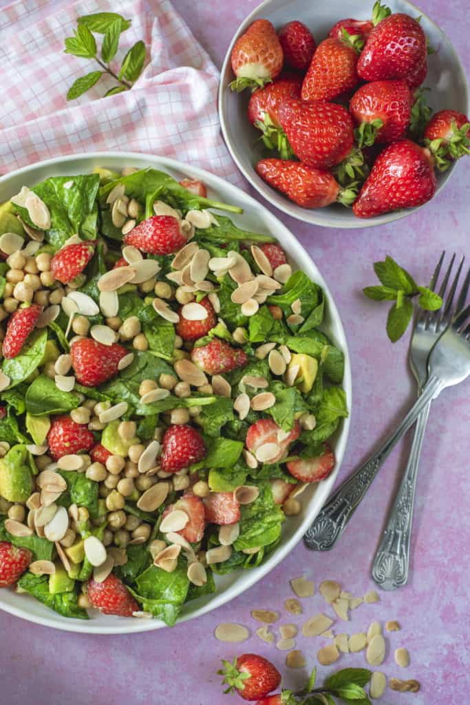 The best healthy salad recipe which combines all my favorite vegetables and fruit in one delicious bite. Serve with my orange dressing that ups the crunch! #healthysalad #strawberrysalad #vegansalad #glutenfreerecipes #summercooking #summerfood