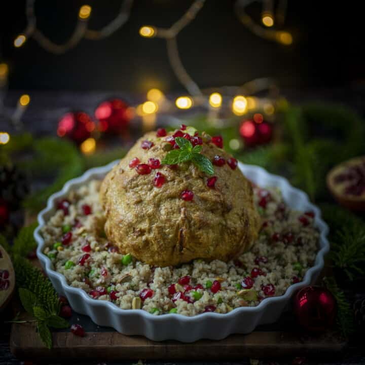 Whole roasted cauliflower with quinoa. So simple. So nutritious. So flavourful. So succulent with a perfect crunch and char. #vegan #veganchristmas #christmasrecipes # quinoa #christmasquinoa #healthychristmas