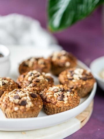 Fluffy, tender, healthy banana chocolate chip muffins made with oats, cinnamon, bananas, and a good handful of chocolate chips. They are insanely good!