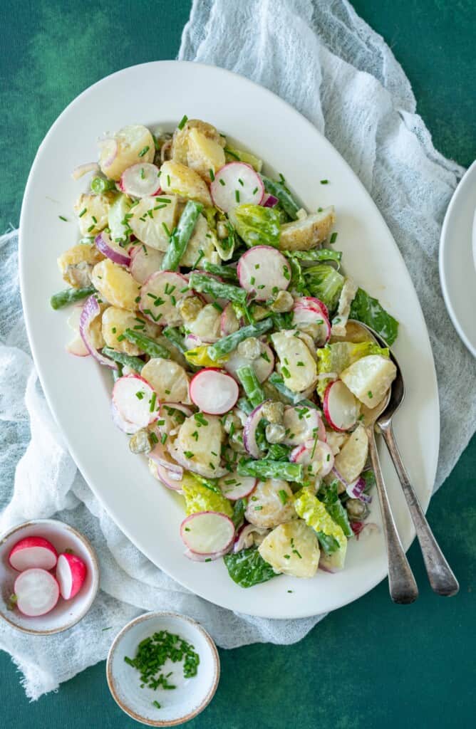 Healthy potato salad recipe made with no mayonnaise only plant-based yoghurt dressing and loads of fresh veggies. Vegan and gluten-free